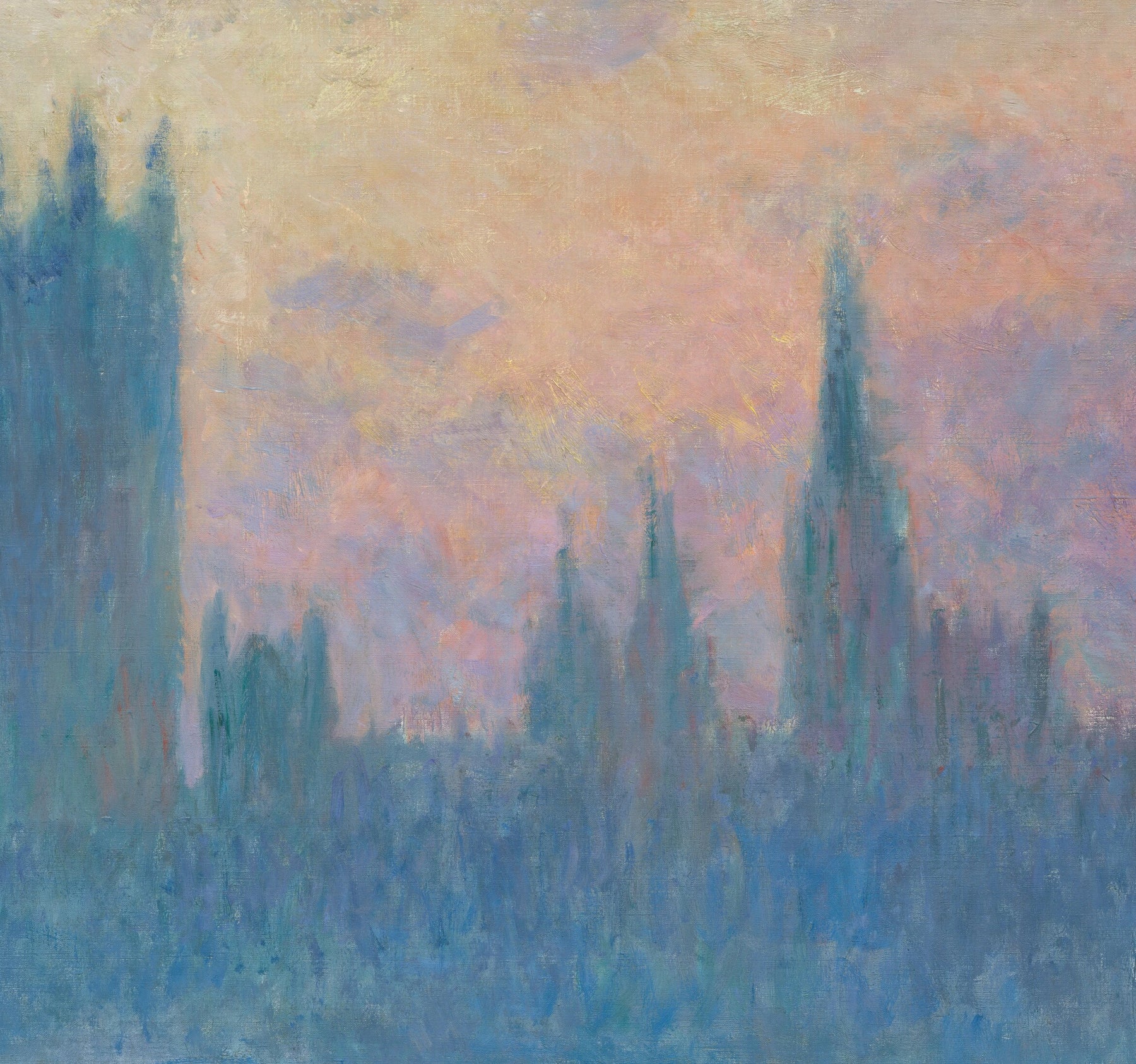 Détail des tours bleues du Parlement dans le ciel rose et jaune du couchant